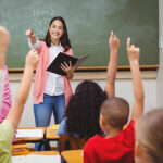 Teacher asking her students a question at the elementary school